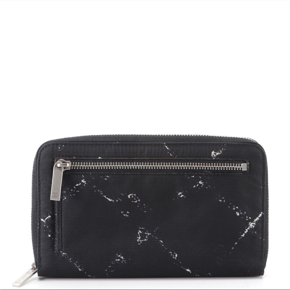 Chanel travel zip around wallet in printed nylon.